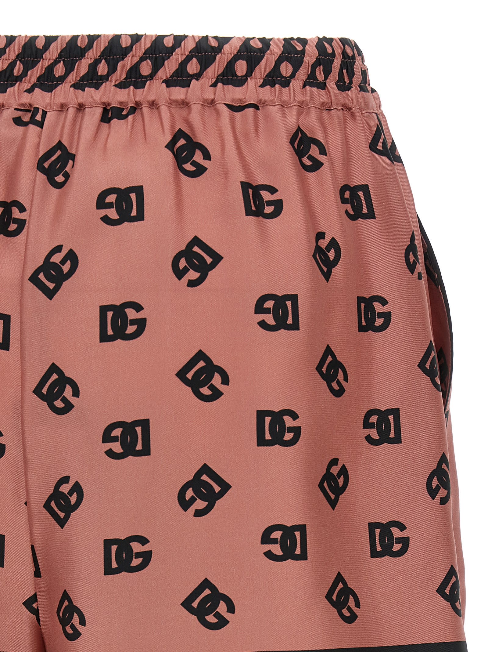 Dolce & Gabbana Pink Bermuda Shorts With Dg Logo Printed All-over In Silk Woman In Pink