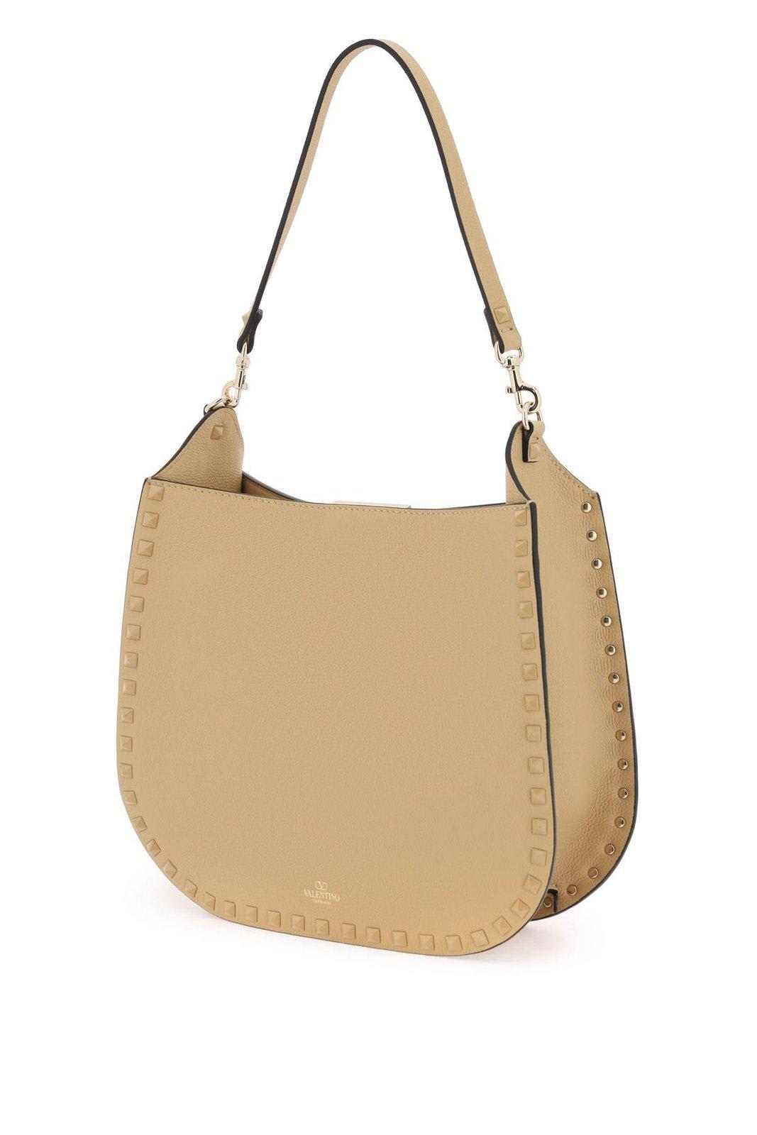 Shop Valentino Garavani Rockstud Strapped Shoulder Bag In Brown