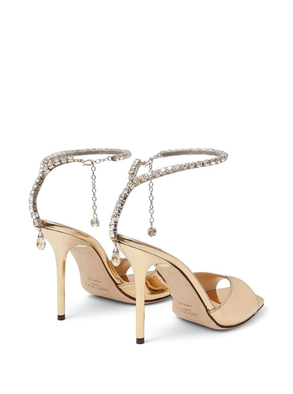 Shop Jimmy Choo Gold-tone Saeda Sandals With Crystal Embellishment In Calf Leather Woman In Metallic