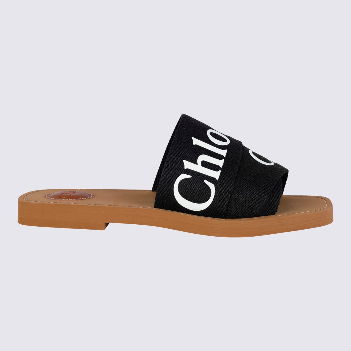 Shop Chloé Black Canvas Woody Flats