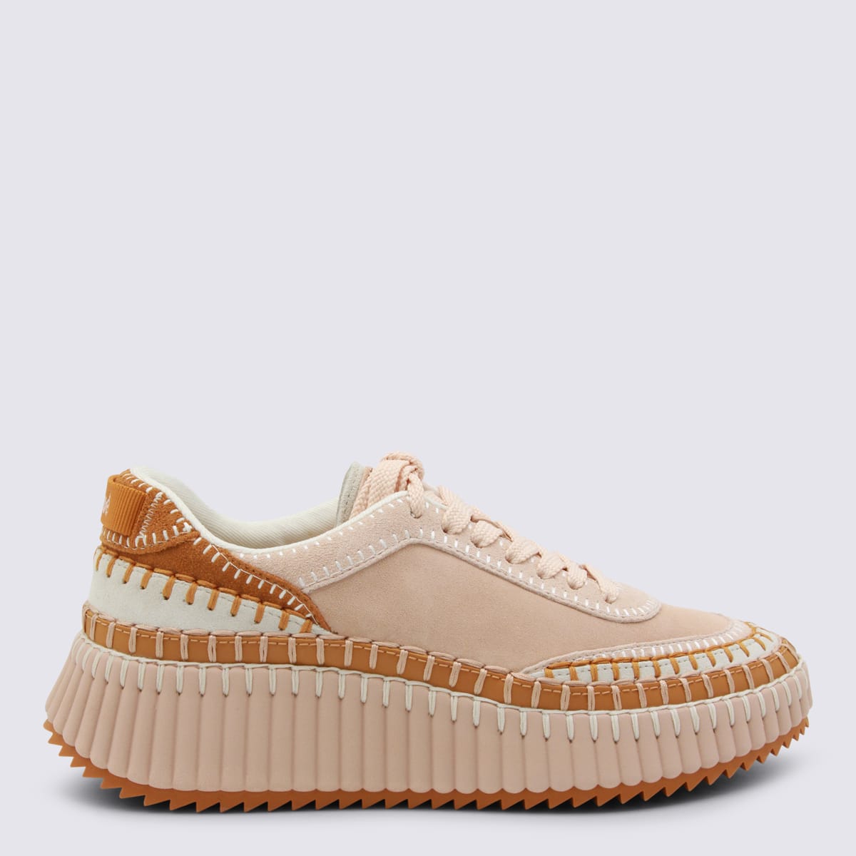 Chloé Low Top Sneakers Featuring Contrast Stitching And Textured Sole In Gold