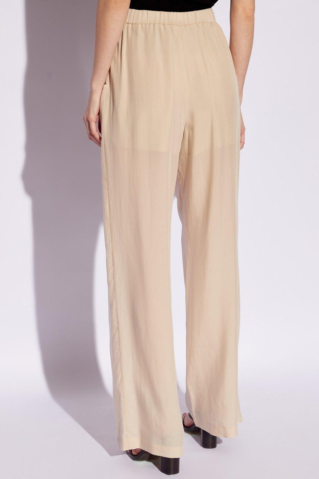 Shop Emporio Armani Loose Fitting Trousers In Beige