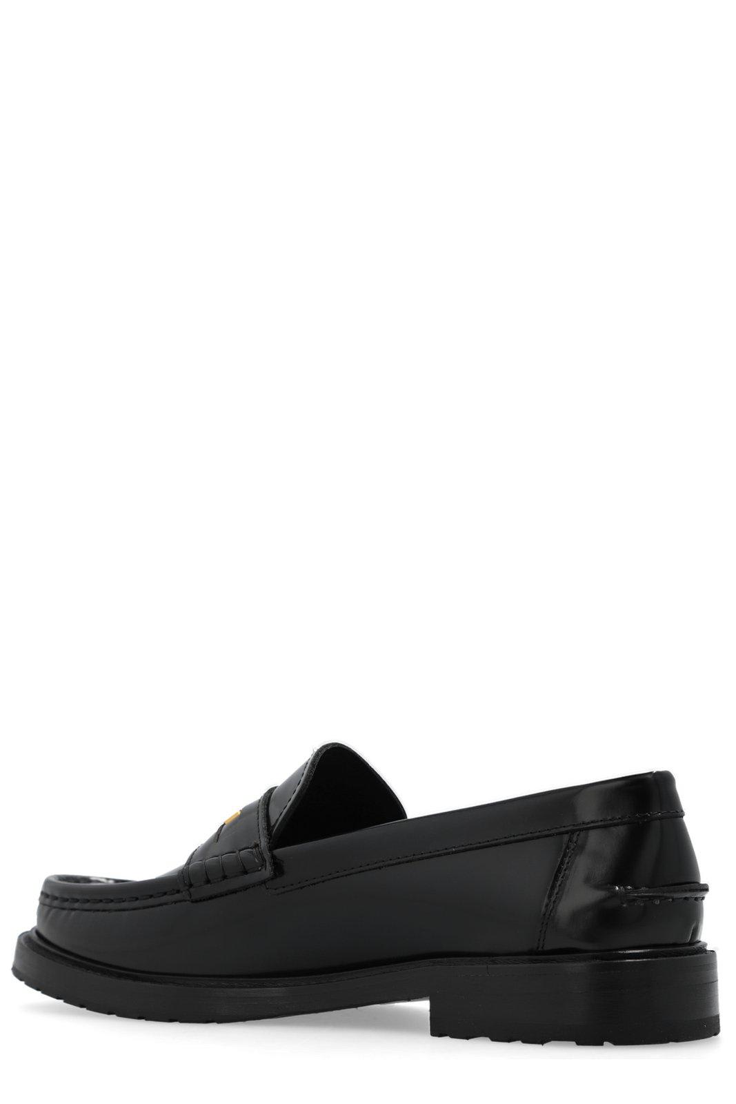 Shop Moschino Logo Plaque Slip-on Loafers In Black