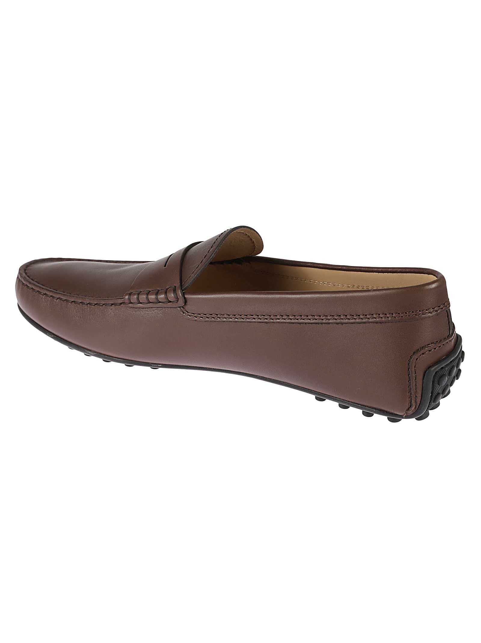 Shop Tod's Logo Engraved Loafers In Brown