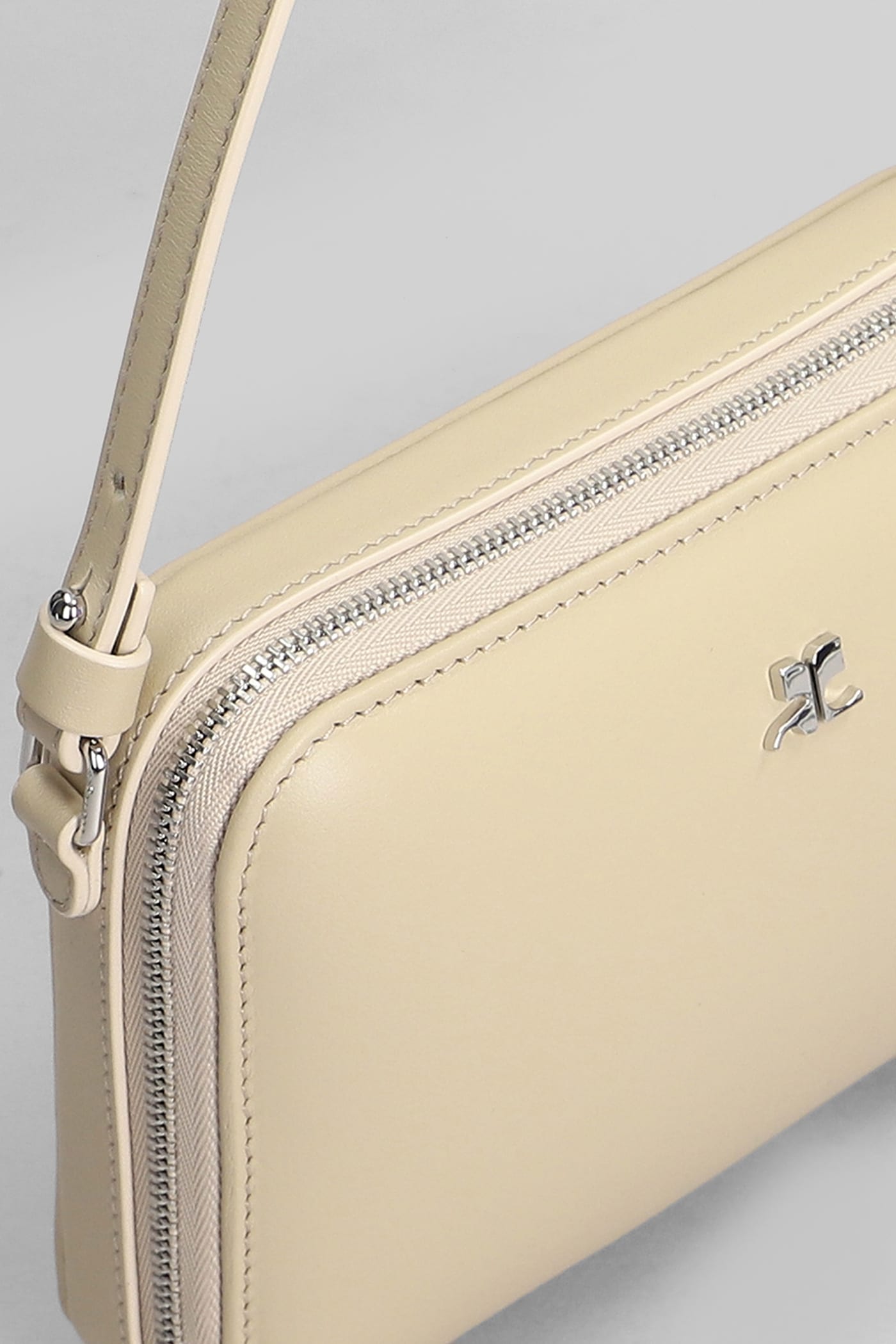 COURRÈGES SHOULDER BAG IN BEIGE LEATHER