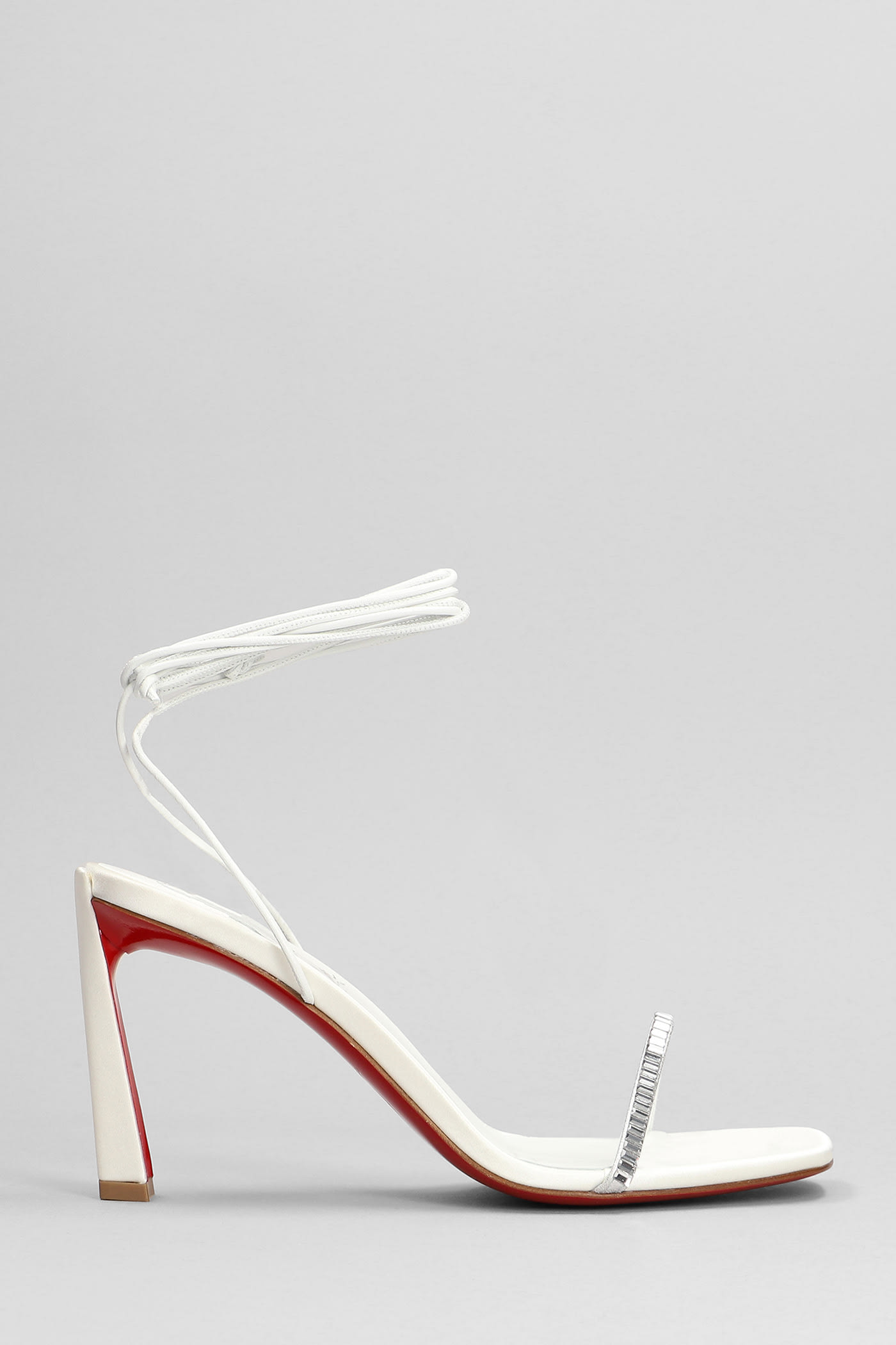 CHRISTIAN LOUBOUTIN CONDORA LACES STRASS SANDALS IN SILVER LEATHER