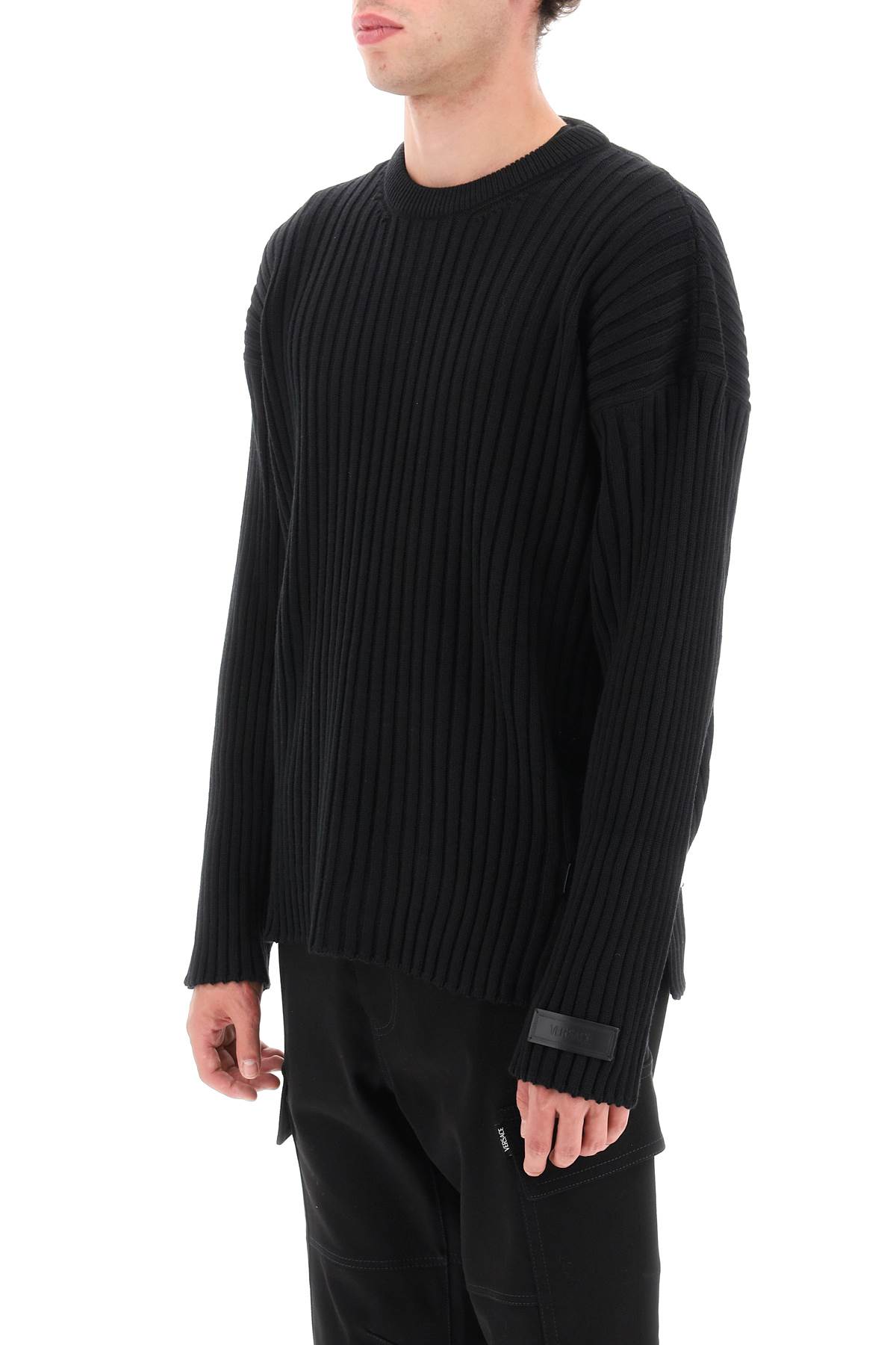 Shop Versace Ribbed-knit Sweater With Leather Straps In Black (black)